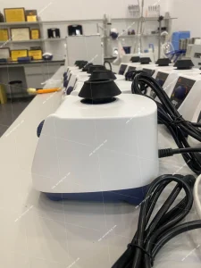 AELAB AVT-501 vortex mixer side view with top mixing cup, white housing, and power cord